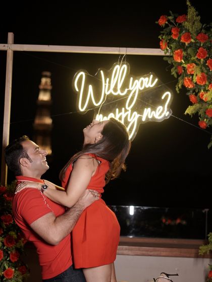 Pure happiness, framed by flowers and the soft glow of a promise. I ensure your proposal photos are as joyful and beautiful as the moment itself.