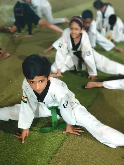 This young green belt shows off an impressive split. His dedication to stretching is clear and will be a huge advantage as he learns more advanced kicks.