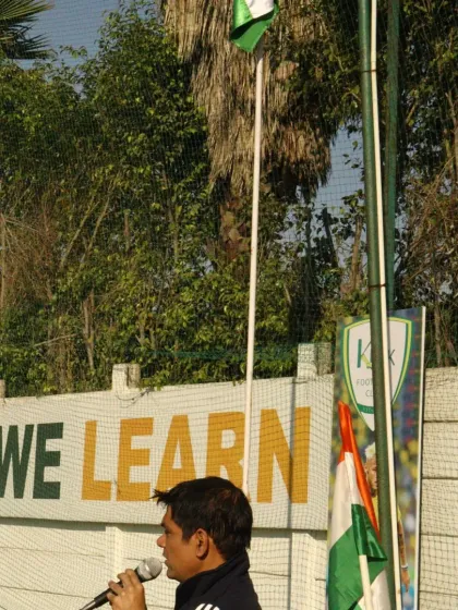 "Either we win or we learn." Our club motto is visible in the background as a coach speaks during the Republic Day event.
