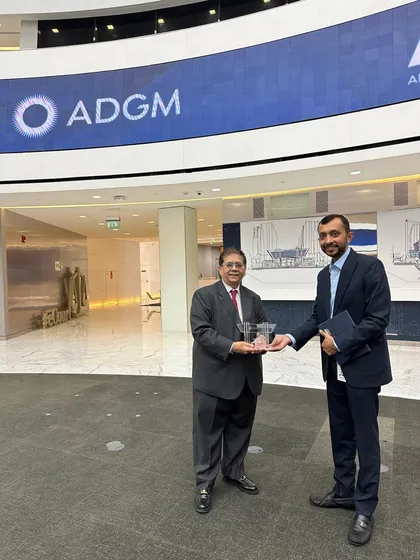 Receiving a token of welcome from the Abu Dhabi Global Market (ADGM) team. We look forward to a successful journey in the UAE.