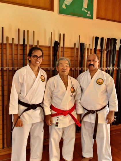 Another photo with a student and an Okinawan Sensei, showing the deep connection between generations of martial artists.