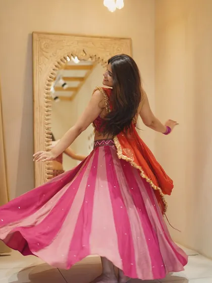 The back view of a Garba twirl, showing how the lehenga flows. It's all in the details.