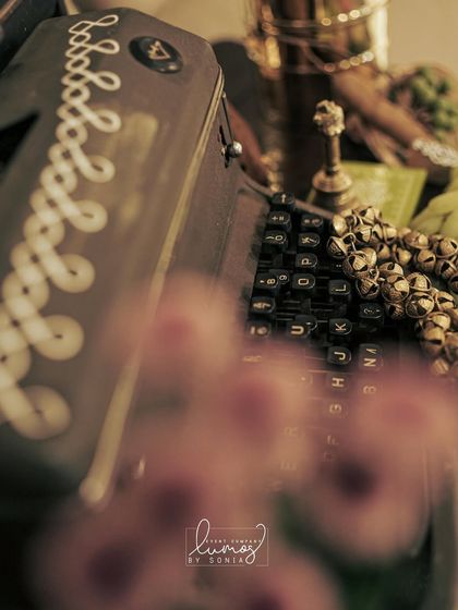 A macro shot of the vintage typewriter and ghungroos, blending storytelling with personal passions.