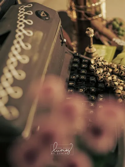 A macro shot of the vintage typewriter and ghungroos, blending storytelling with personal passions.