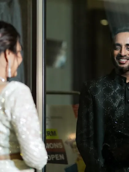 The groom's happy expression upon seeing his bride for the first time.