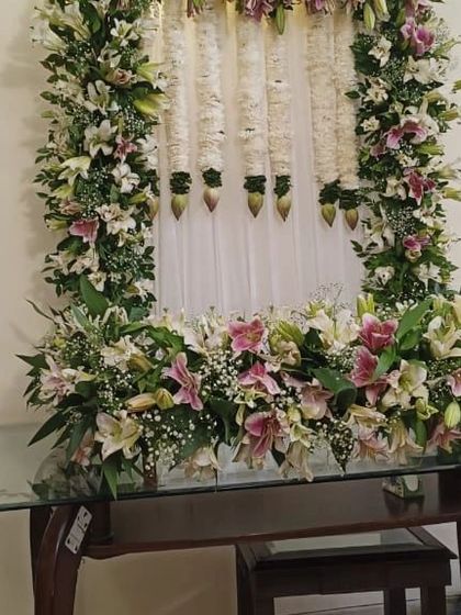 A clear view of the elegant Ganpati floral frame, perfect for creating a divine atmosphere at home.