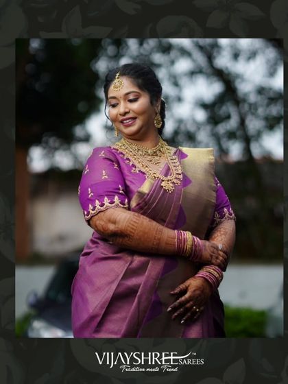 This client chose a stunning purple Kanjivaram with a beautifully embroidered blouse for her special day.