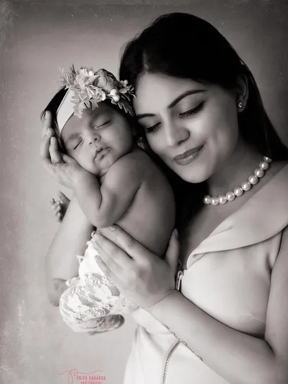 The quiet magic between a mother and her newborn. This classic black and white portrait highlights the soft light and even softer love in this timeless moment of motherhood.