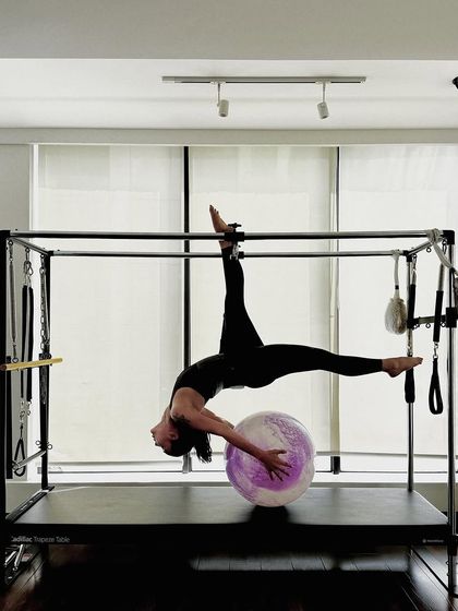 A final shot of this stunning pose, capturing the beauty and power of advanced Pilates.