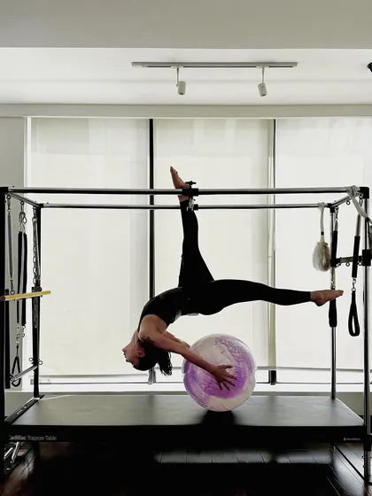 A final shot of this stunning pose, capturing the beauty and power of advanced Pilates.