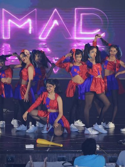 The full "Harley Quinn's" crew posing on stage. The teamwork and fun they have is evident in every performance at our annual showcase.