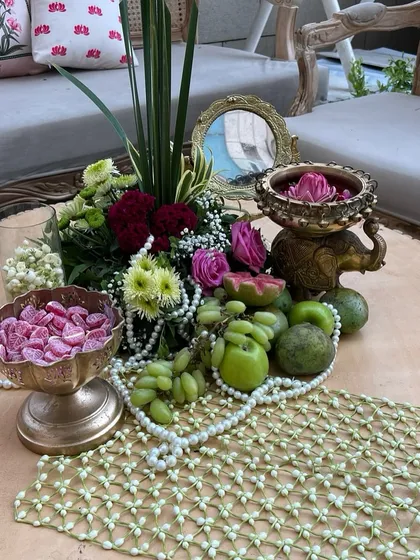 Another angle of the 'Bagh-e-Ishq' centerpiece, showing the intricate details of the mogra jaal table runner and brass elephant decor.