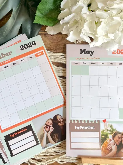A side-by-side comparison of different monthly pages from the planner calendar, showcasing the customizable photo slots.