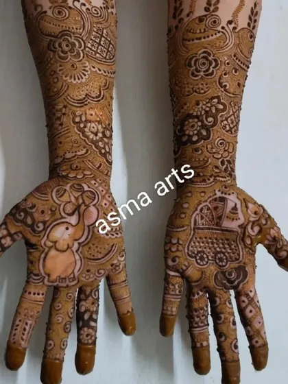 Baby shower mehendi is so much fun to create. This design features a cute baby elephant on one palm and a baby cradle on the other, perfect for celebrating a mom-to-be.