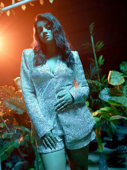 A moody shot from a music video set. I can adapt my look and performance to match the specific aesthetic of your song.