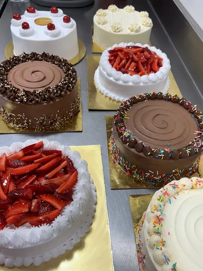 A lineup of some of our classic cakes ready for delivery. From fresh strawberry to rich chocolate, we promise you won't be disappointed with our variety and quality.