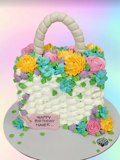 A surprise gift inside a cake. This floral basket cake was designed to hold an iPhone inside, revealing an amazing gift when the cake is cut.