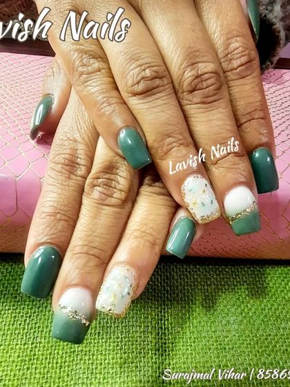 A beautiful combination of solid green and accent nails with a gold foil and glitter fade.