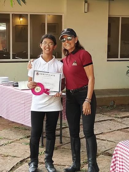 This young rider is all smiles as she receives her camp certificate. We look forward to welcoming our campers back for another season of fun and riding.