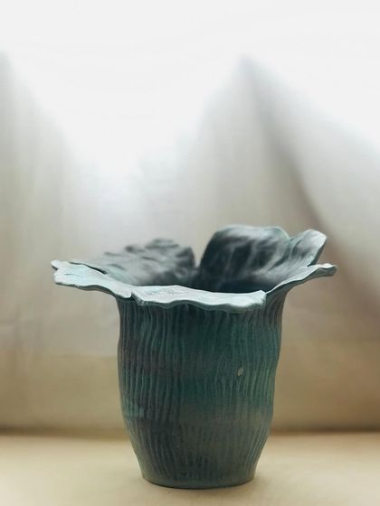 A different perspective of the Wild Petal Vase, highlighting its delicate, flower-like edges.