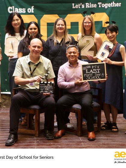 Faculty and staff join in the celebration, posing with signs for the Class of 2026. Our educators are an integral part of our students' journeys, supporting them from their first day to their last.