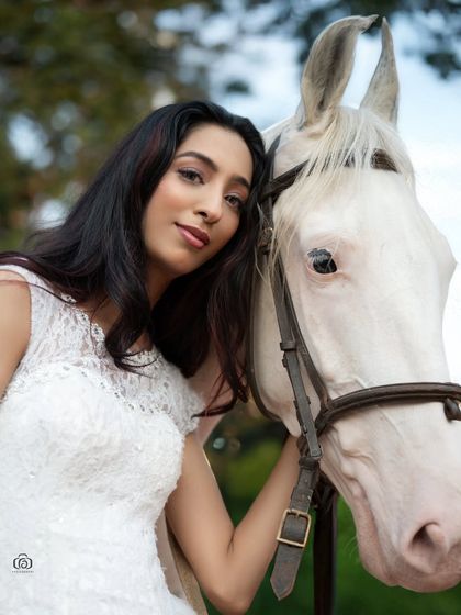 A close-up portrait of the model with the horse. This shot highlights the gentle interaction between them, creating an emotional and compelling image.