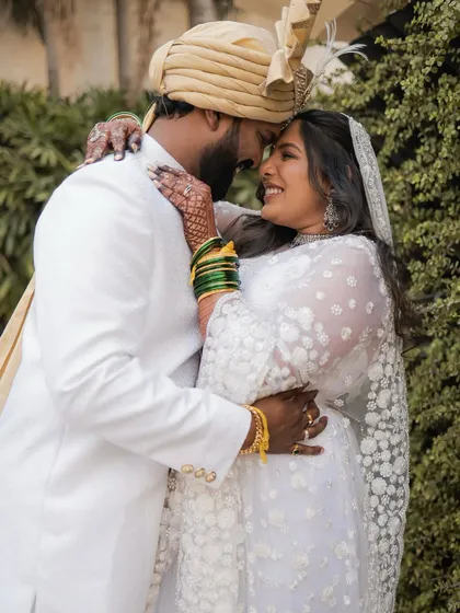 An intimate portrait of the couple from their Buddhist wedding. The bride's subtle makeup enhances her natural beauty and happiness.