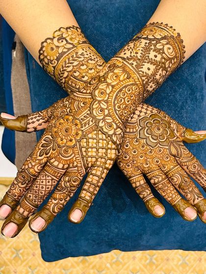 A crossed-hands pose showing the beautiful symmetry and detail of this non-bridal design.