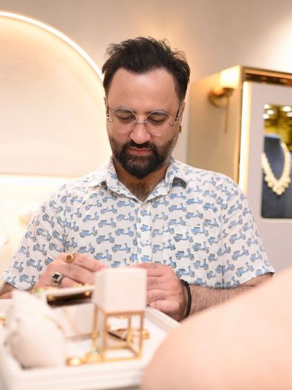 A gentleman exploring our collection of men's rings and cufflinks during a private showcase.