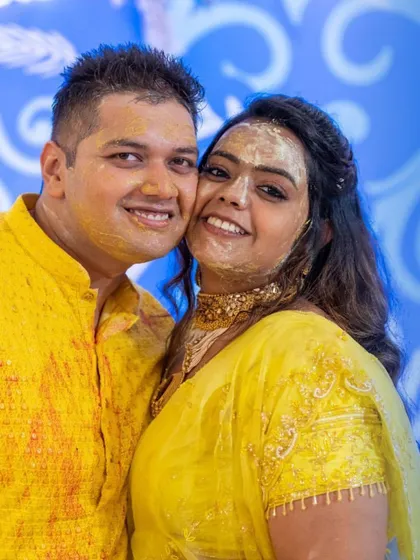 All smiles from Darshit and Khushali during their Haldi. The yellow on their faces is a symbol of the bright and happy future ahead.