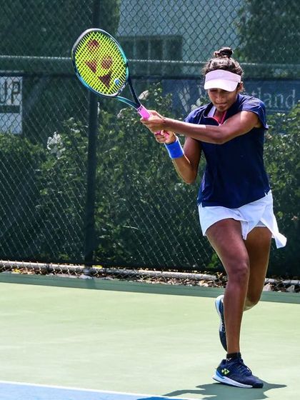 Sahaja unleashes a forehand during the ITF W100 tournament, a testament to her aggressive and skillful play.