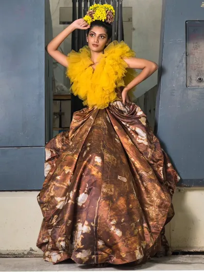 A creative composition from the marble factory shoot, using industrial machinery as a framing device. The contrast between the soft yellow tulle and the hard metal creates a compelling visual story.
