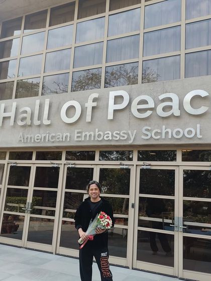 Our instructor outside the American Embassy School's Hall of Peace after a successful cross-cultural dance workshop.