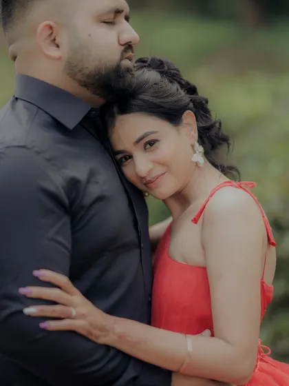 A quiet moment of togetherness. The woman rests her head on her partner's chest, her eyes closed in contentment, perfectly capturing the feeling of safety and love.