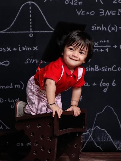 Contact us today for the finest baby shoot services, like this adorable 'back to school' theme.