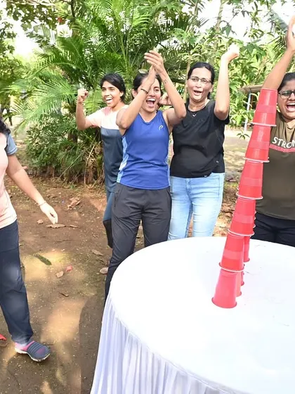 The thrill of victory during a team-building game. I organize a variety of activities, like this cup-stacking challenge, that are simple, fun, and perfect for getting everyone cheering for their colleagues.