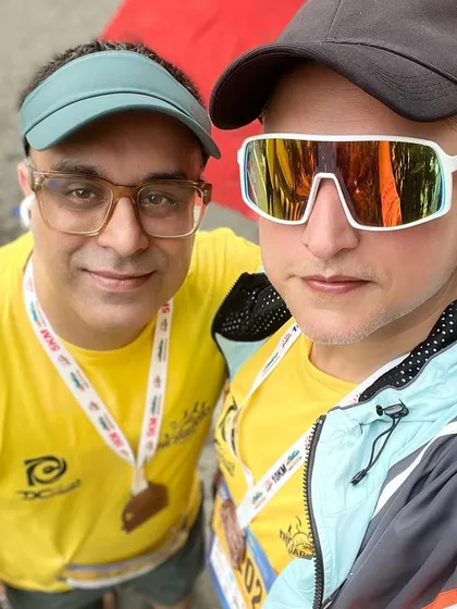 Two members with their finisher medals. The bling is a great reward for all the hard work.