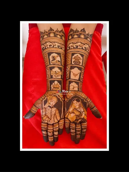 A classic bridal mehendi with detailed portraits of the bride and groom. The arms are filled with various wedding elements, telling the story of the ceremony.