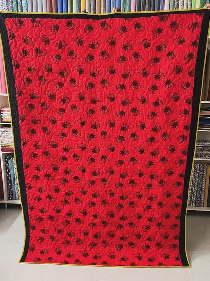 The back of the silk quilt, featuring a simple but elegant floral print.