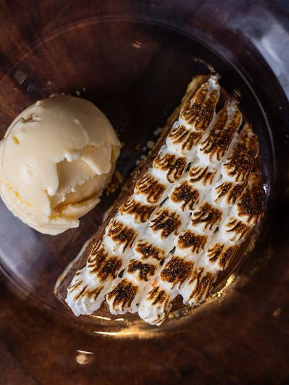 The perfect end to any meal. Treat yourself to our Hazelnut Chocolate dessert with its torched meringue, served with a scoop of cinnamon ice cream.