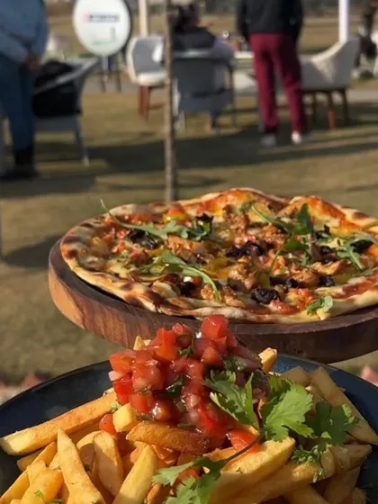 Satisfy your cravings on and off the range. Our cafe serves up delicious pizza and fries that are perfect for sharing.