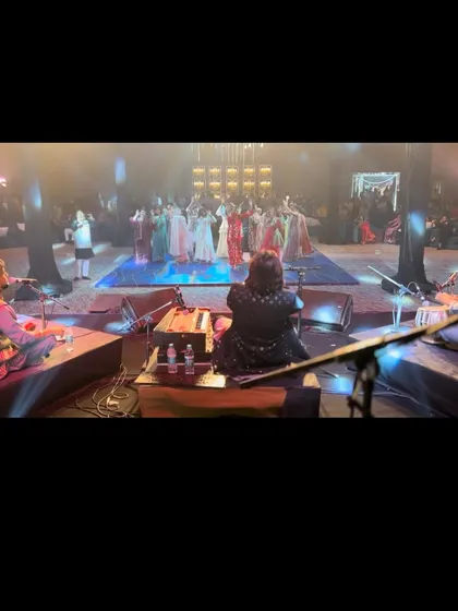 A view from the stage, looking out at the audience dancing. This perspective shows the scale of the events we perform at and the energy we command.