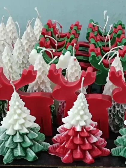 Getting into the Christmas spirit with a large order of festive candles. This image shows a collection of Christmas tree candles, reindeer candles, and other holiday-themed designs ready for the season.