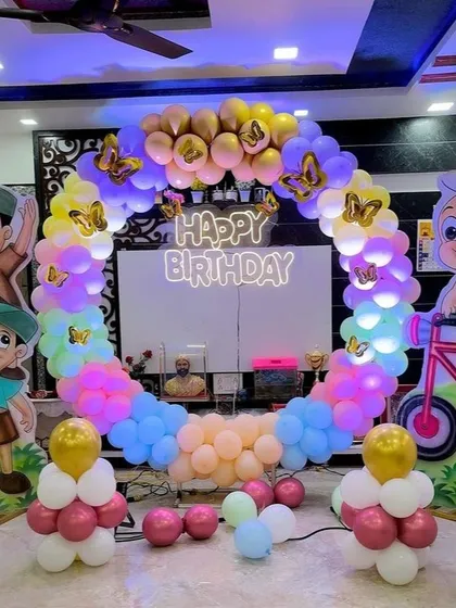 A colorful and fun Chhota Bheem themed birthday party. We created a full balloon ring in rainbow colors and placed cutouts of the popular cartoon characters around it, making it a hit with the kids.