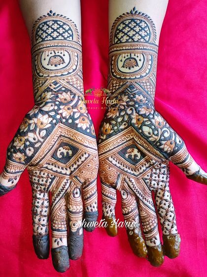 A striking design for a 'meenakari' lover, this piece uses bold, dark-filled areas to create a high-contrast look with baby elephant motifs.