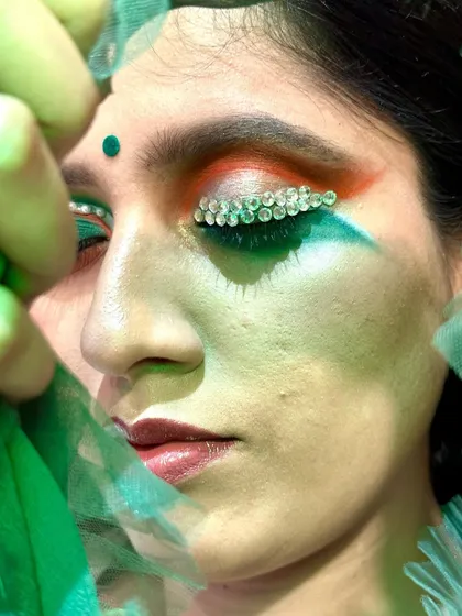 A close-up of my conceptual Independence Day makeup. This shot highlights the detailed application of crystal embellishments along the lash line, set against a tricolor blend of eyeshadow. It demonstrates my ability to execute artistic and thematic concepts with precision.
