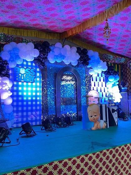 The full view of the Boss Baby stage with dramatic blue lighting, creating an exciting atmosphere for the celebration.