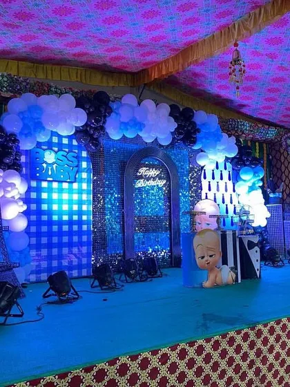 The full view of the Boss Baby stage with dramatic blue lighting, creating an exciting atmosphere for the celebration.