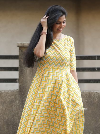 Soak up the sunshine in our airy summer palazzo set. This yellow chevron print outfit is light, stylish, and made for comfort.