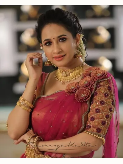 A closer portrait of Manvita Kamath in the 3D embellished half saree, showing the intricate floral work on the shoulder and sleeve.
